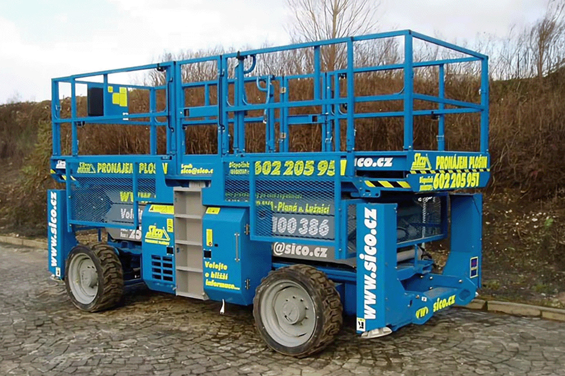 Before — yard photo of construction machine